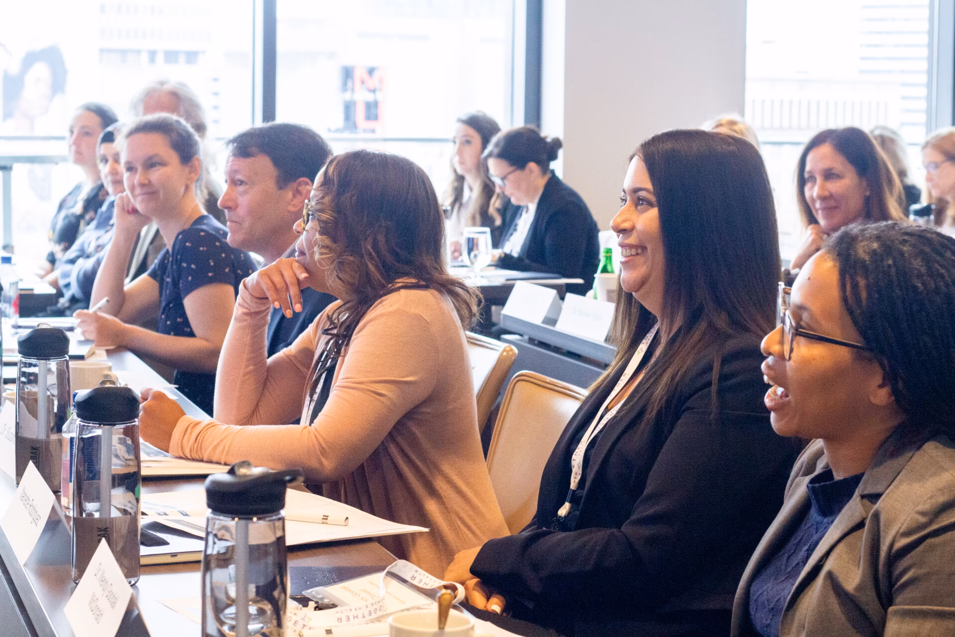 Executives attend a meeting at Shore Capital Partners Office